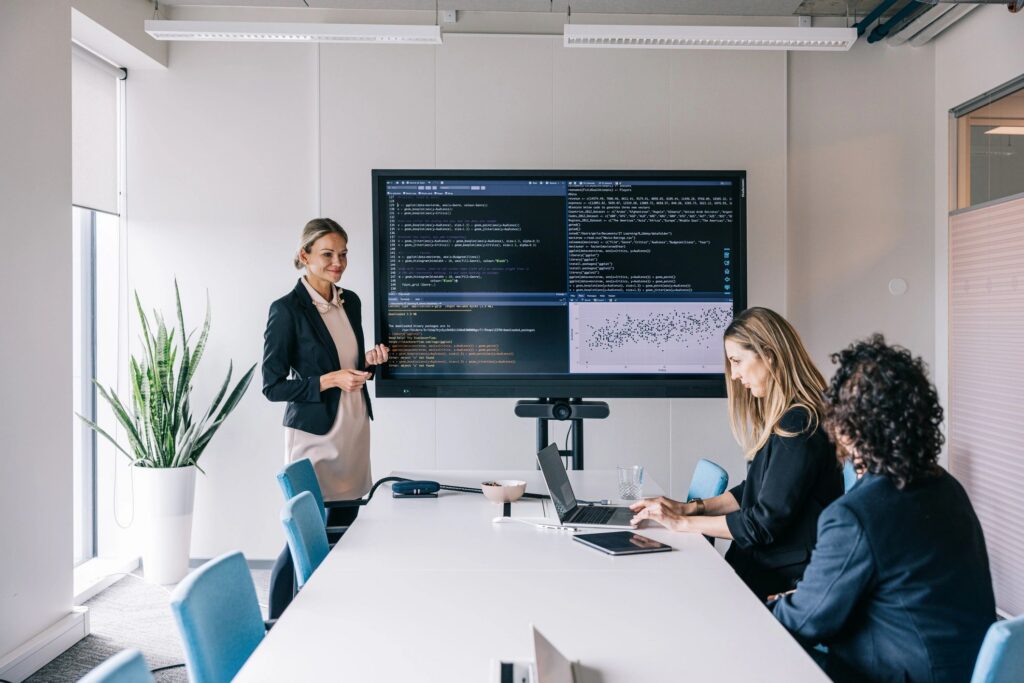 A group of Software developers working together at a team meeting
